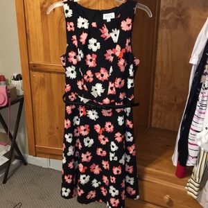 Pink and white flower print on a black dress